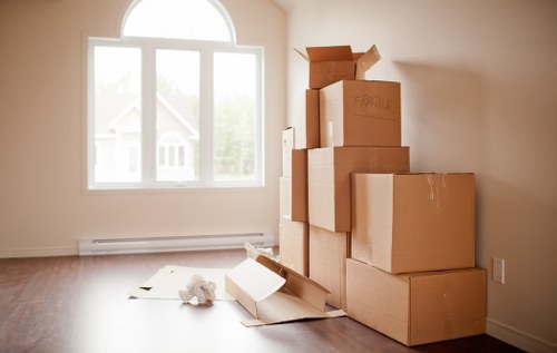 Flat removals team planning a move in Stockwell with boxes and furniture