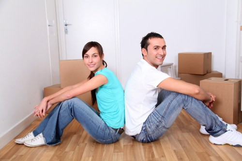 Moving boxes and furniture carried down stairs in a Stockwell flat removal